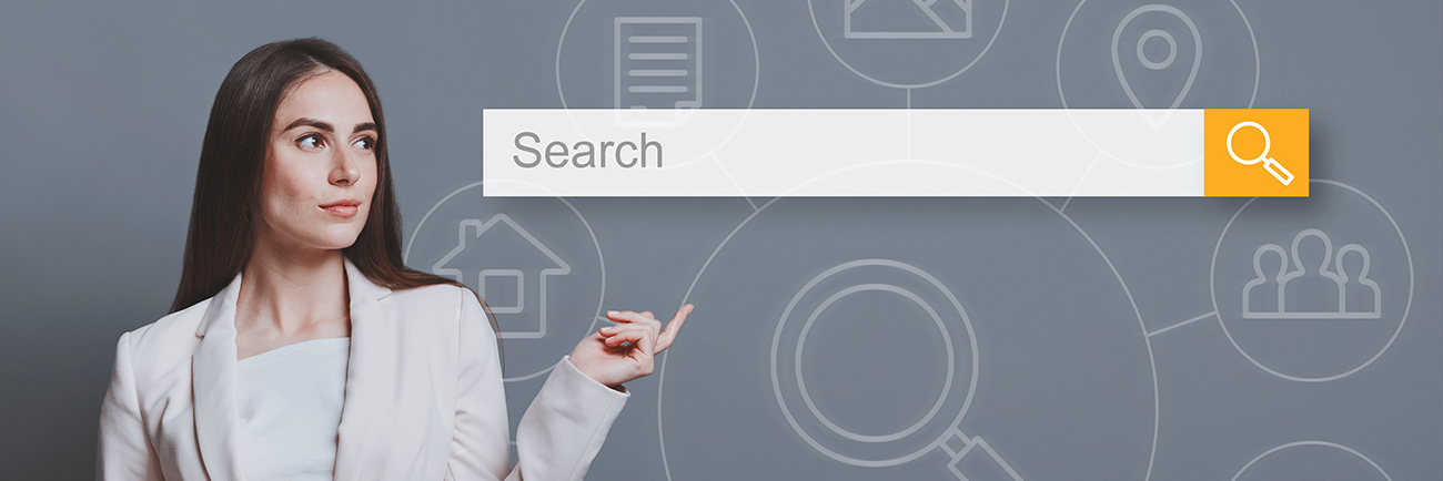 Businesswoman searching for website with seo service pointing finger at search bar